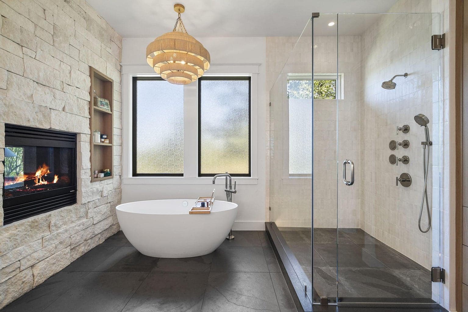 Victoria + Albert soaking tub atop a heated slate floor