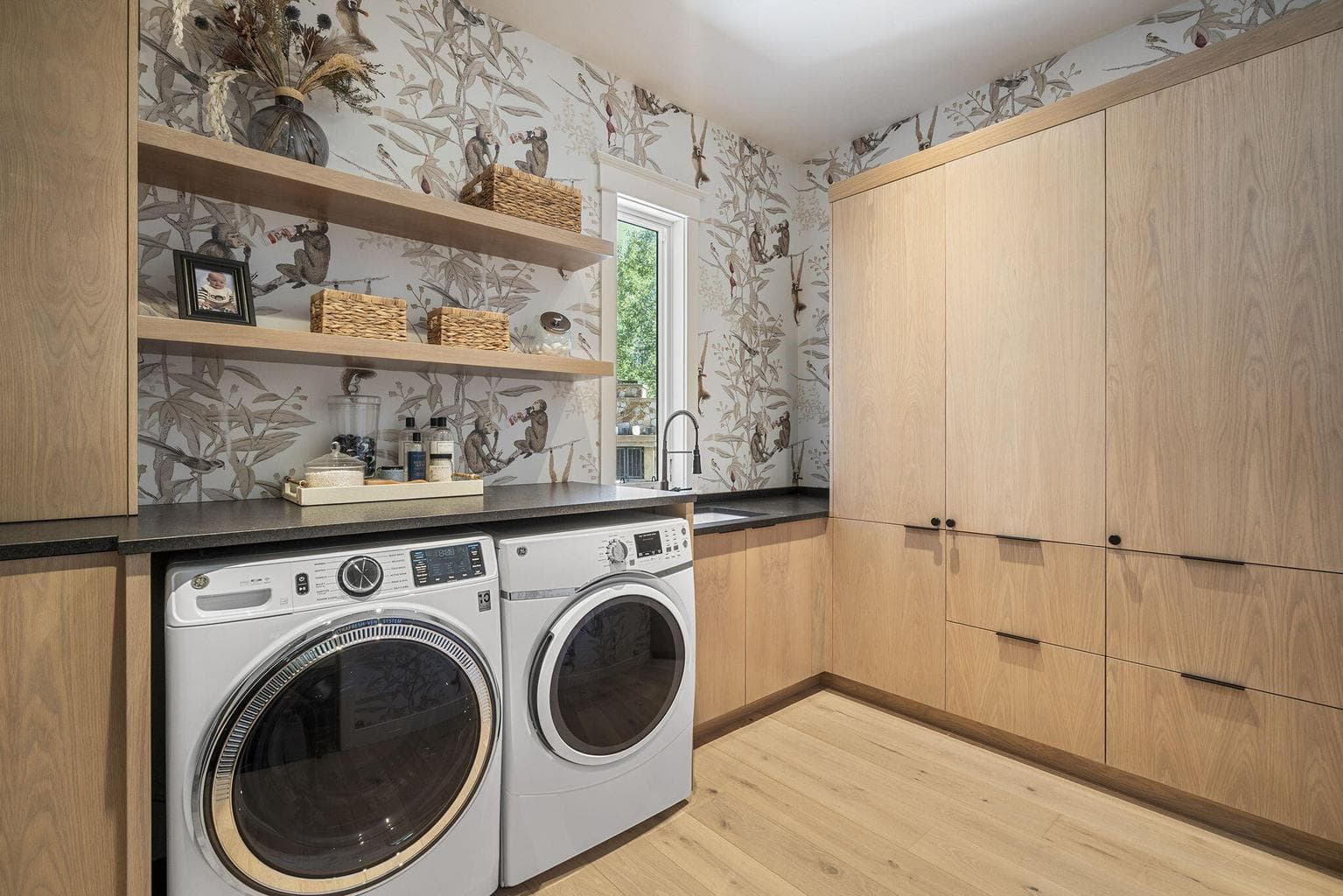 Enviable laundry and mud room with utility sink (there's a 2nd laundry room upstairs not shown)