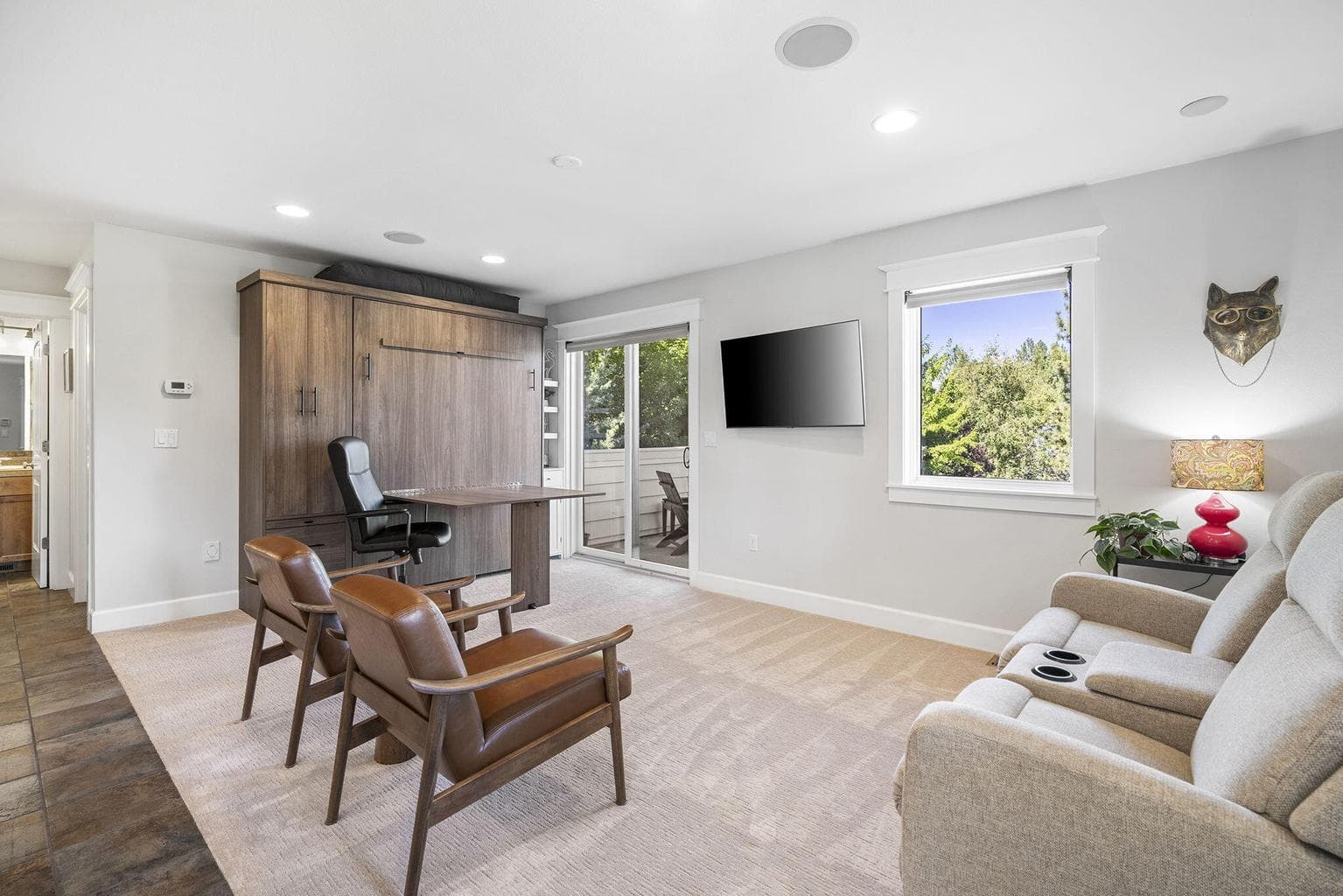 Separate ADU has a custom built Murphy bed with integrated table/desk