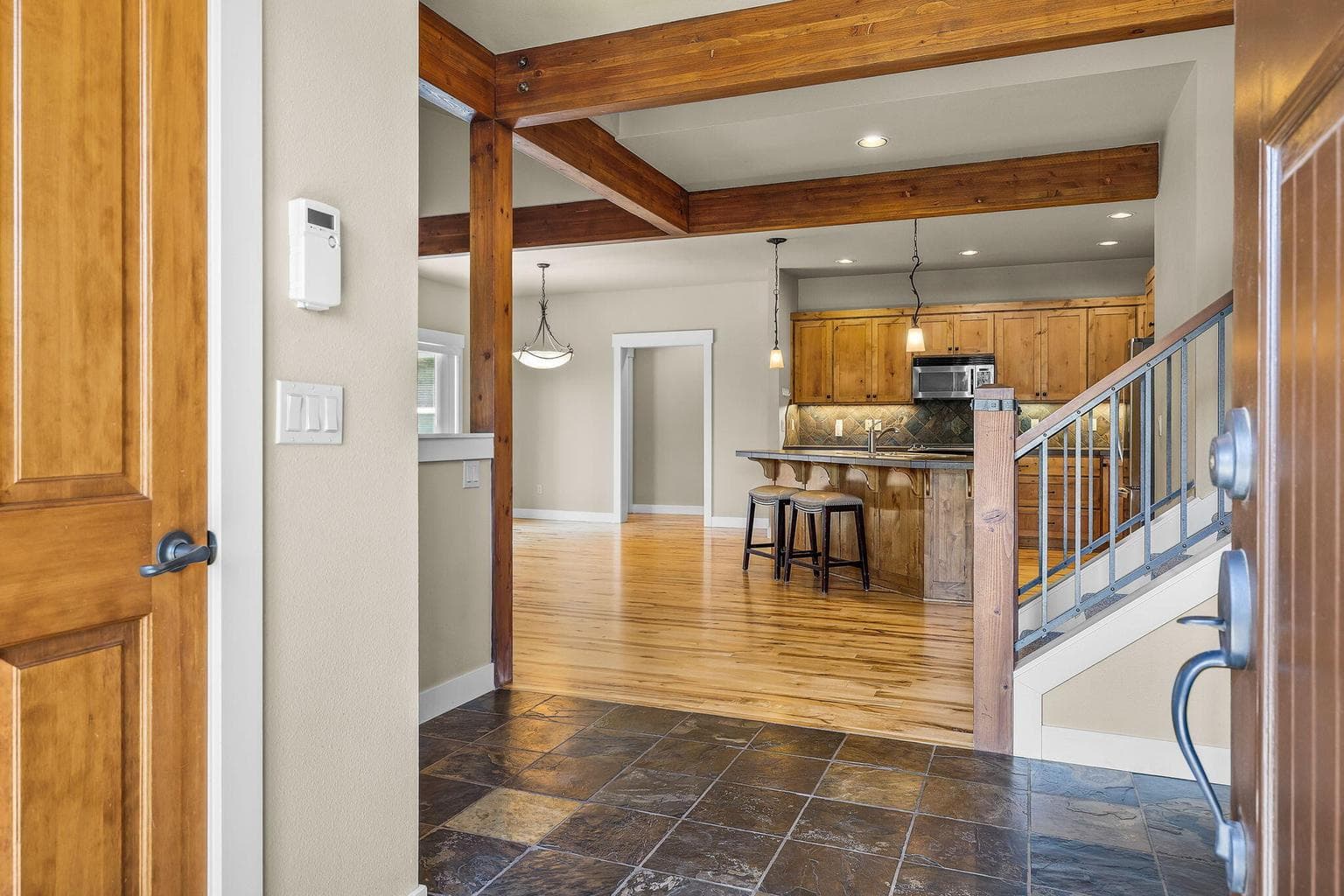 Home features newly re-surfaced and refinished hardwood flooring, new A/C, new carpeting and upgraded padding (2023), new interior & exterior paint (2021 & 2025), new fridge, range & dishwasher installed in 2022.