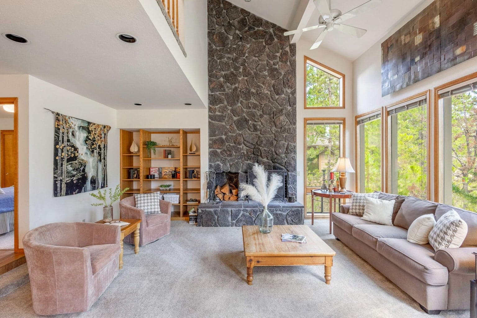 Living room with classic Sunriver wood burning fireplace and tons of natural light