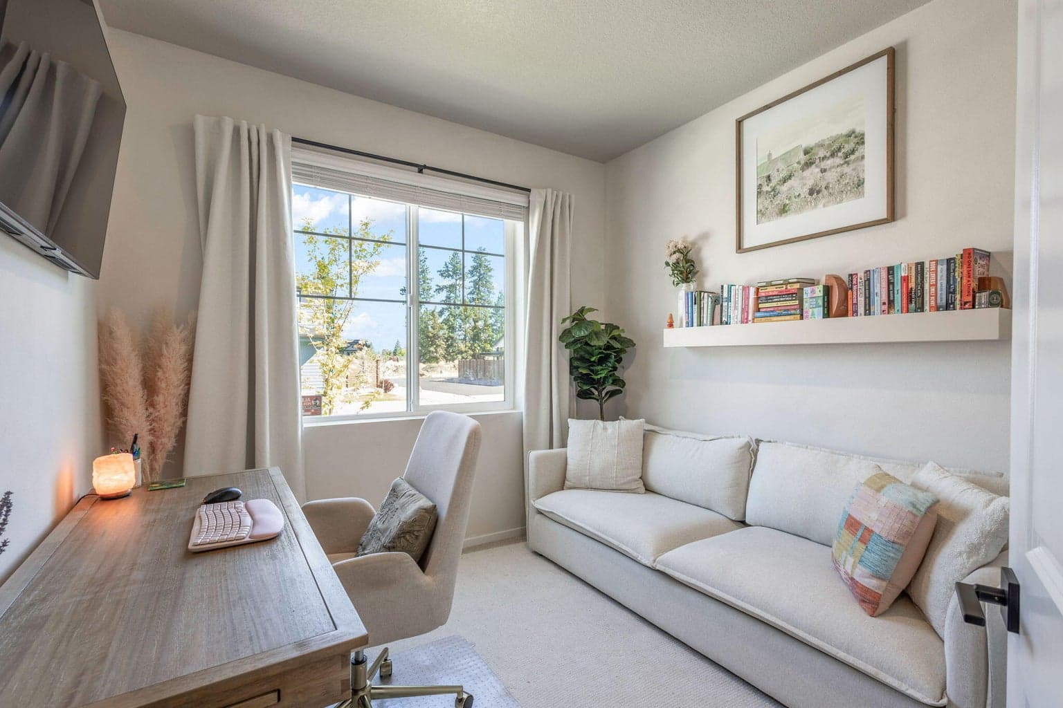 Currently used as a home office. Overlooks the front walk.