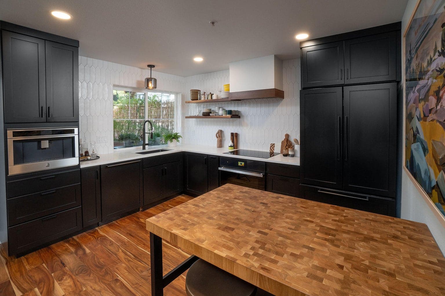 Custom cabinets include cabinet facing on the refrigerator and dishwasher. JennAir appliances including a built in coffee maker for your own barista at home. The induction stove top is a dream to cook on!