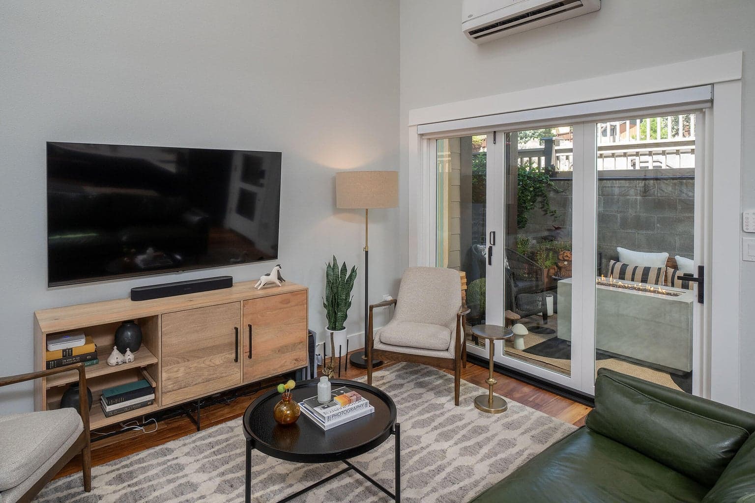 Cozy and comfortable living space is open to the kitchen with easy transition to outdoors. Great for entertaining.