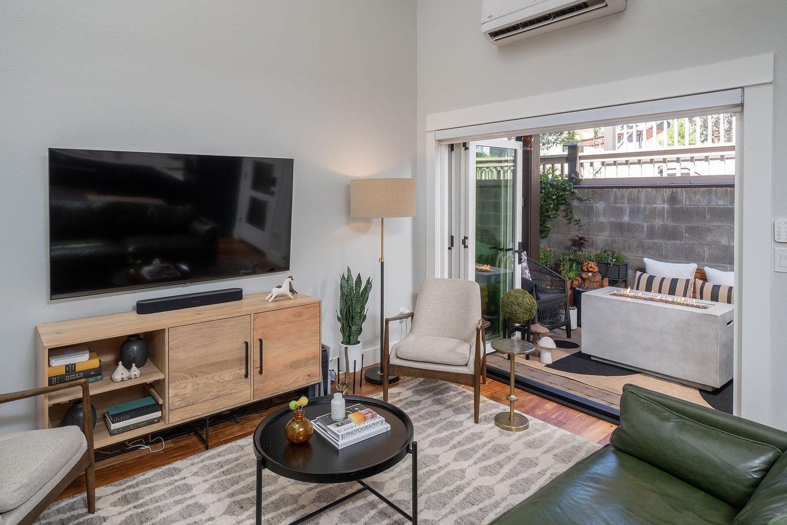 The living room with trifold doors brings the outdoors in.