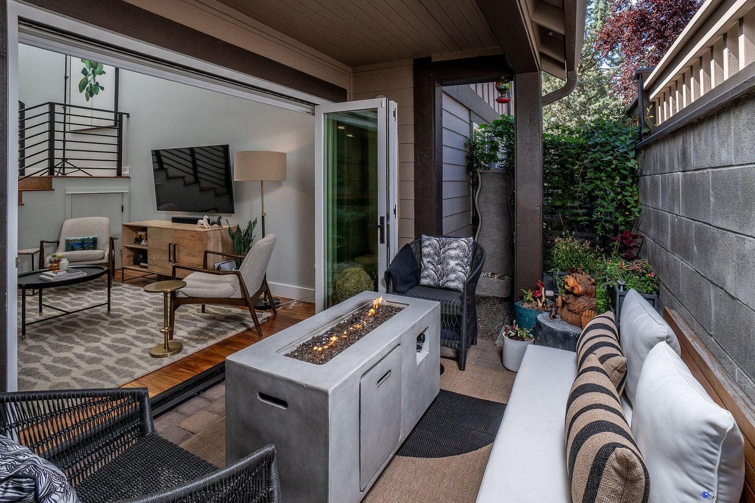 The tri fold doors open for an indoor/outdoor living space.