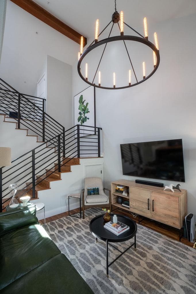 Vaulted ceilings in addition to the custom iron railing really open up the space.