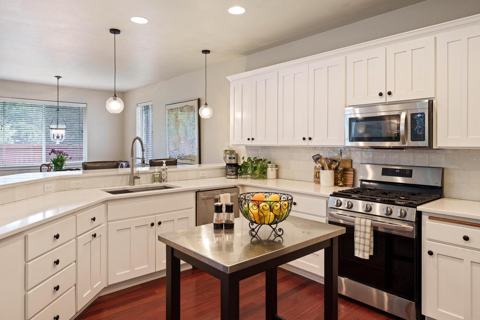 Fresh white cabinets and quartz countertops.
