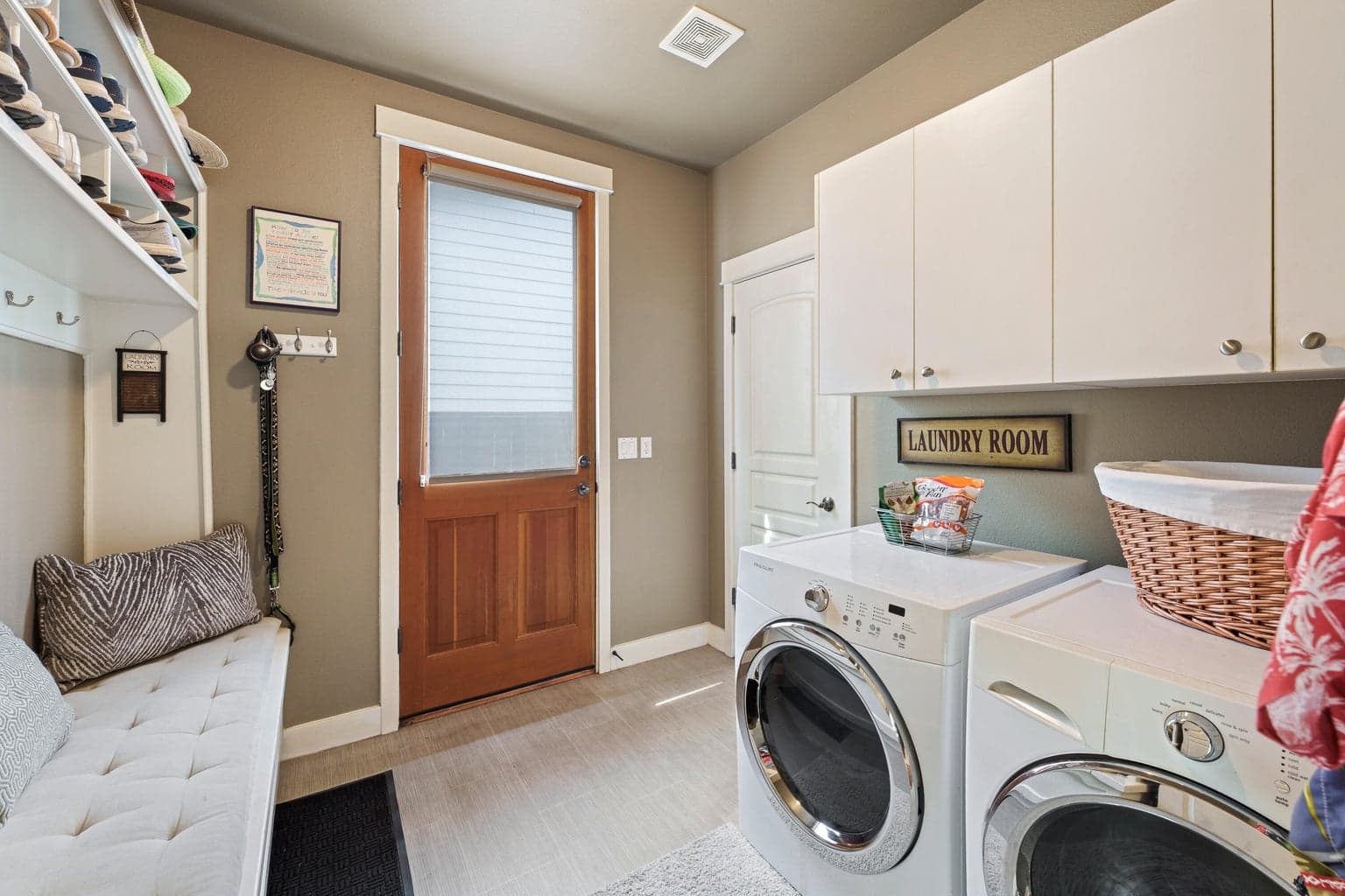 Downstairs laundry/mud room with access to backyard/dog run.