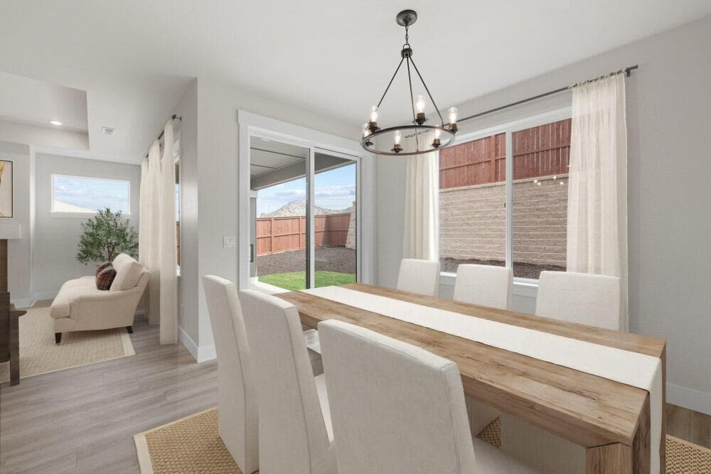 Dining area leads to large covered patio (virtual staging)