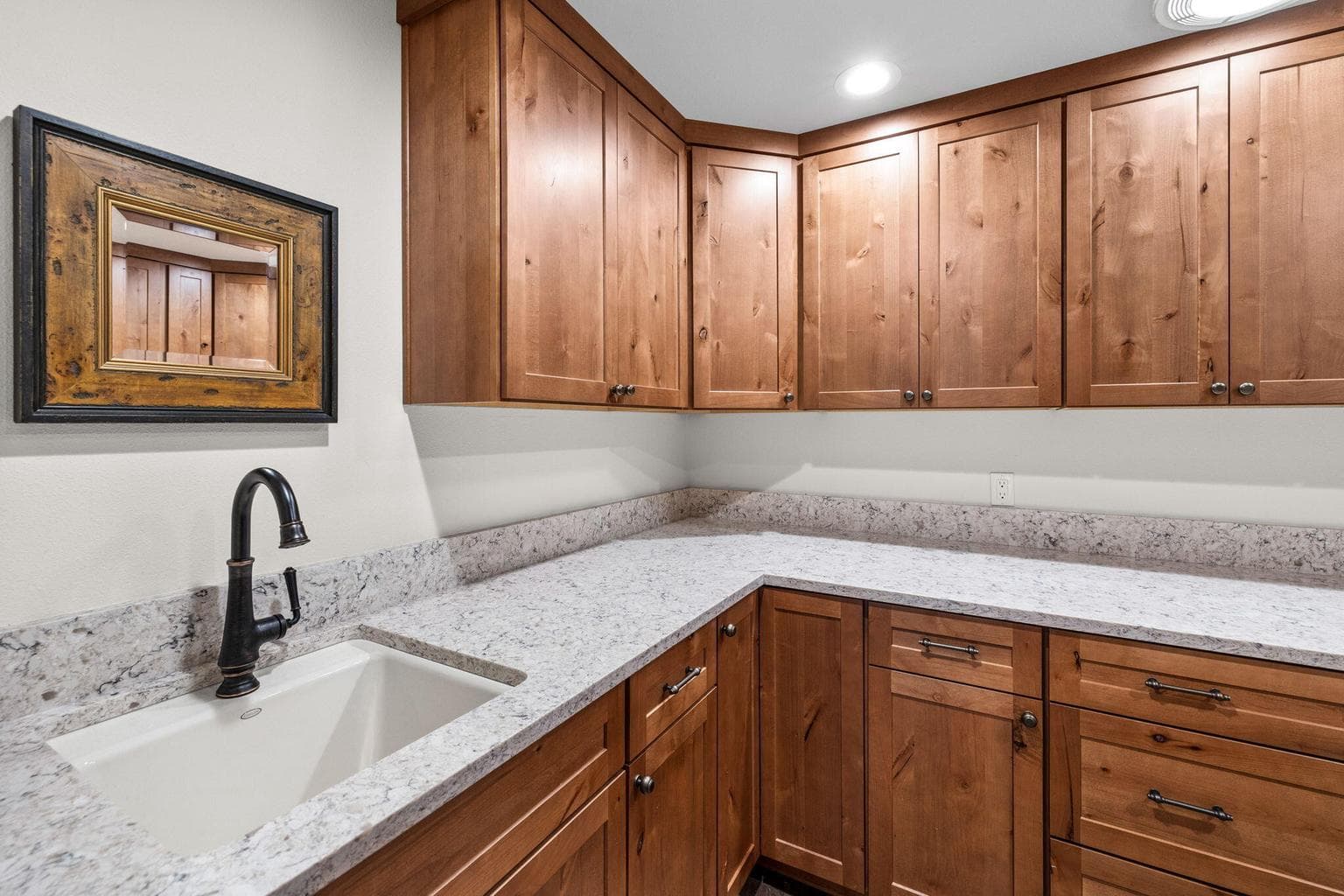 Laundry Room with sink, custom cabinets and quartz countertops