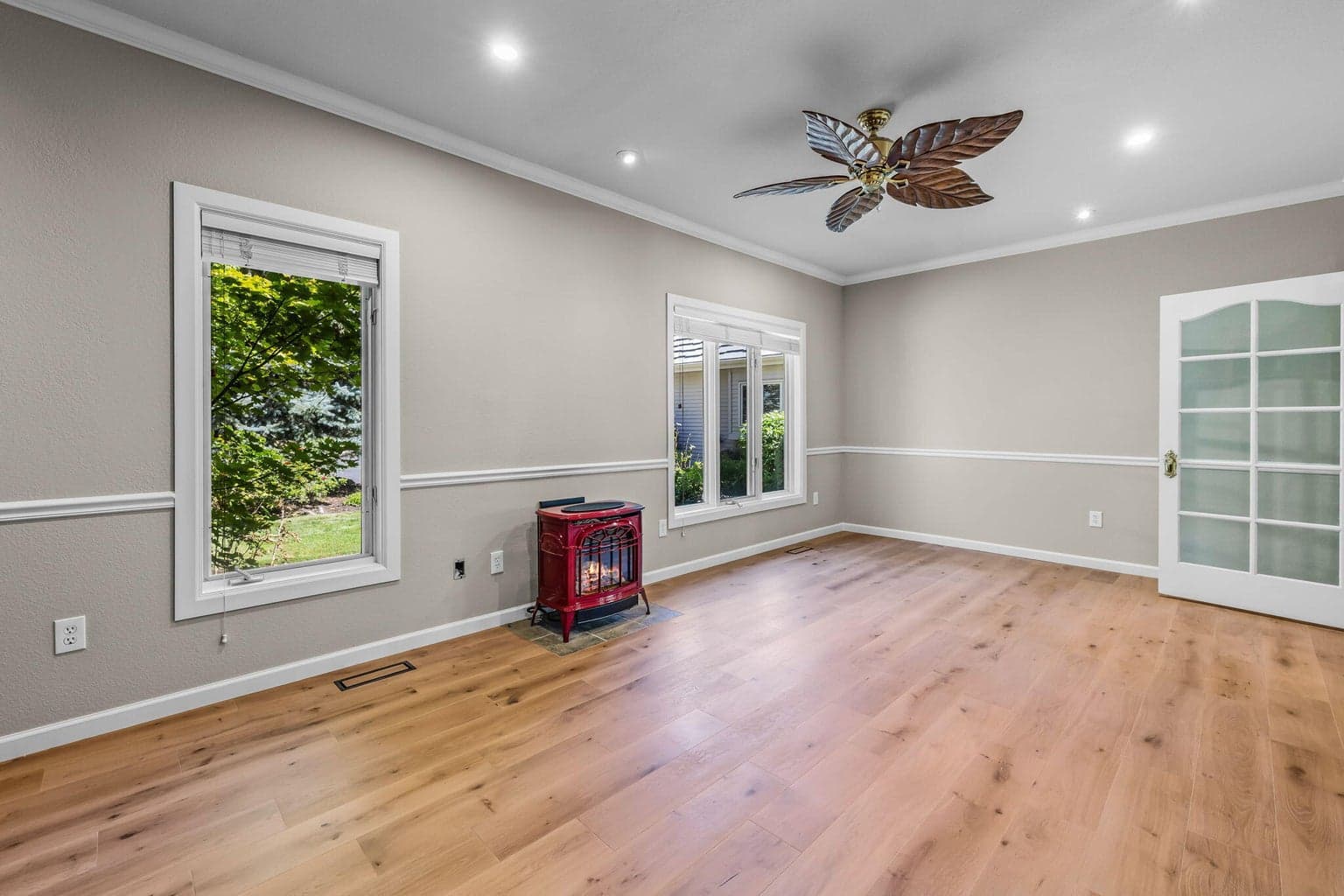 With a cozy fireplace, this room is spacious enough to provide room for multiple uses