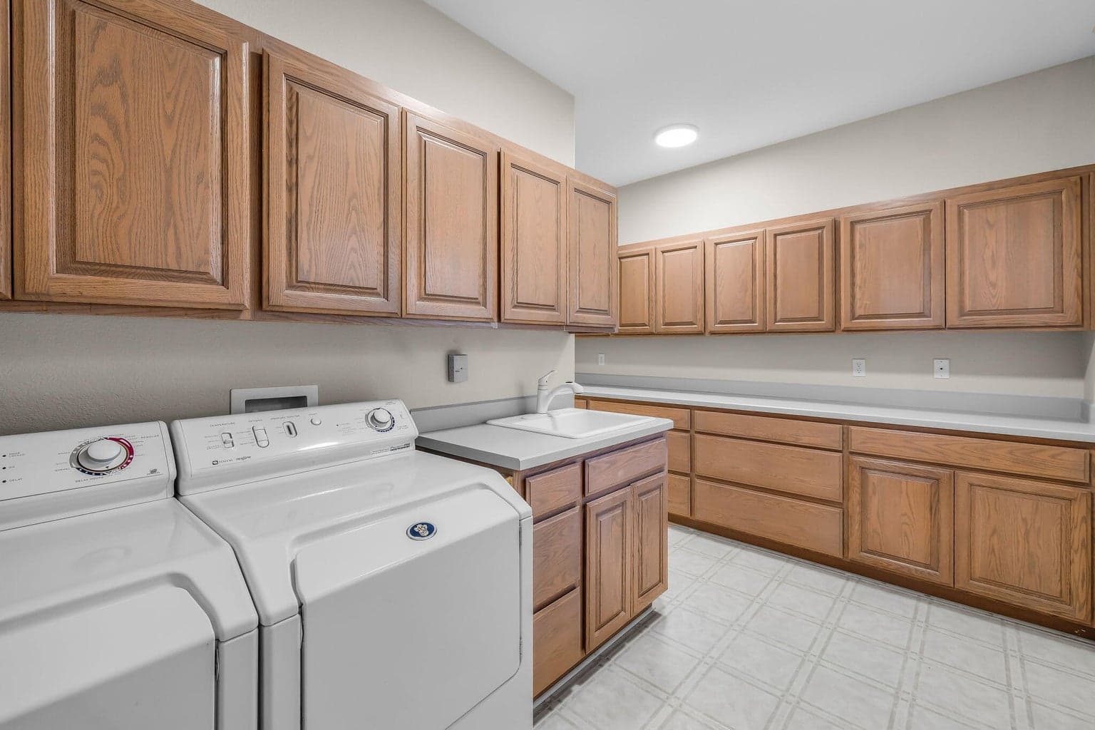 Oversized laundry room with plenty of workspace