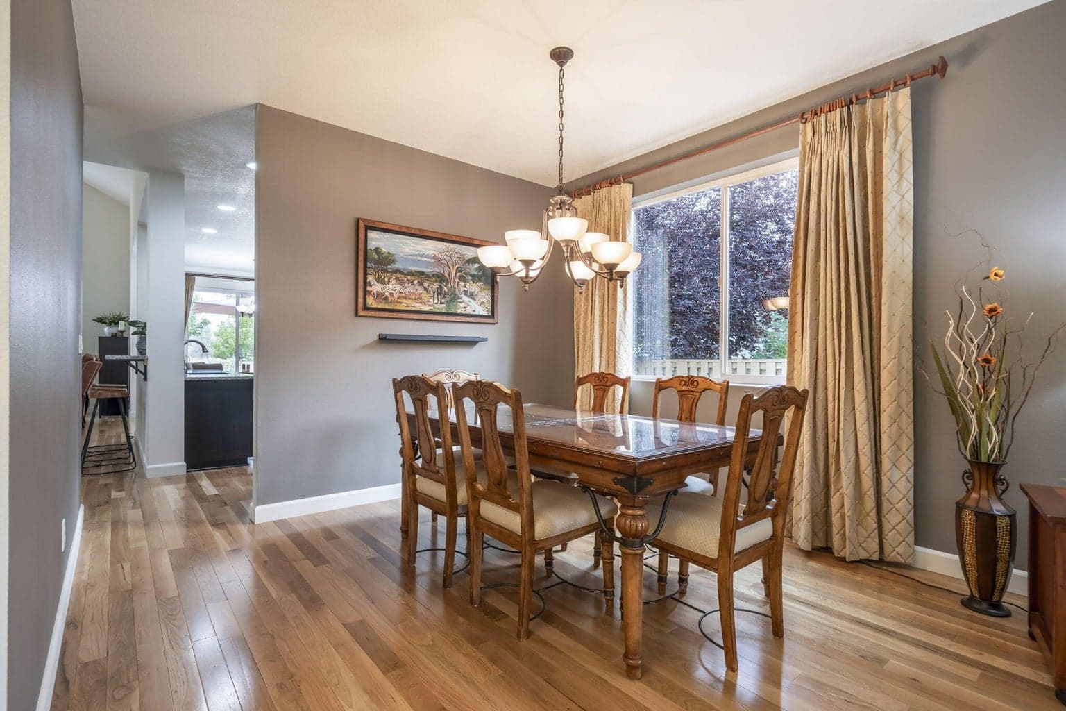 The dining space sits between the the living room and the kitchen.