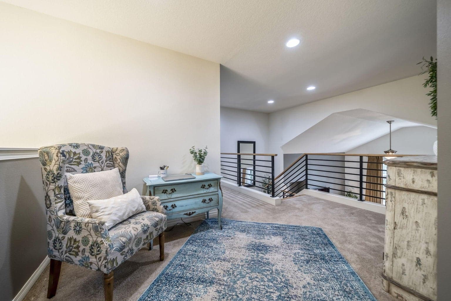 The loft at the top of the stairs provides extra living space.
