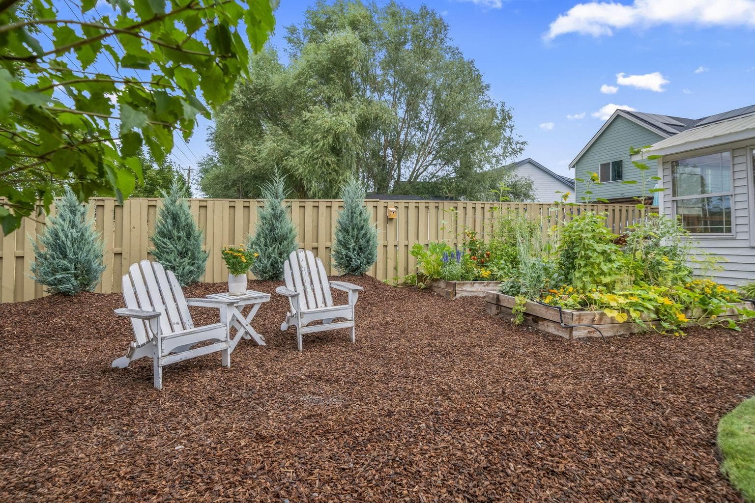 Yet another place to relax in your outdoor space. Bring your chairs, bench or swing of your choice and take it all in.