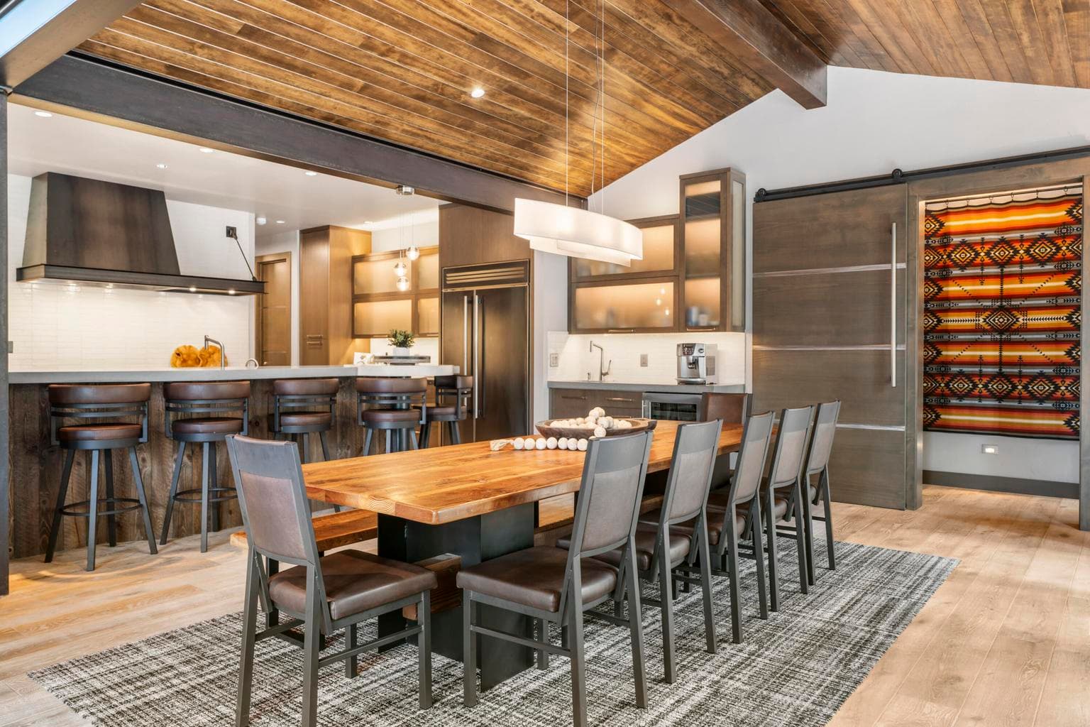 Additional luxury touches include hand-routed steel-trimmed doors, custom cabinetry & lighting throughout.