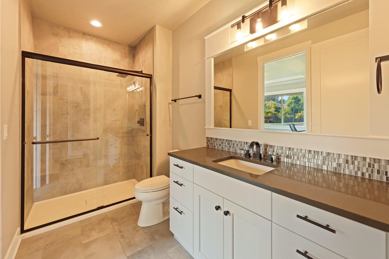 Guest suite bathroom with separate entrance to hallway