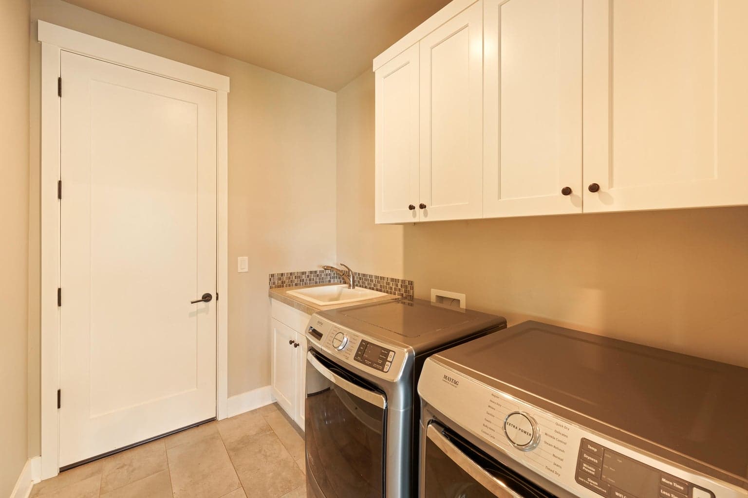 Laundry room and entrance to garage