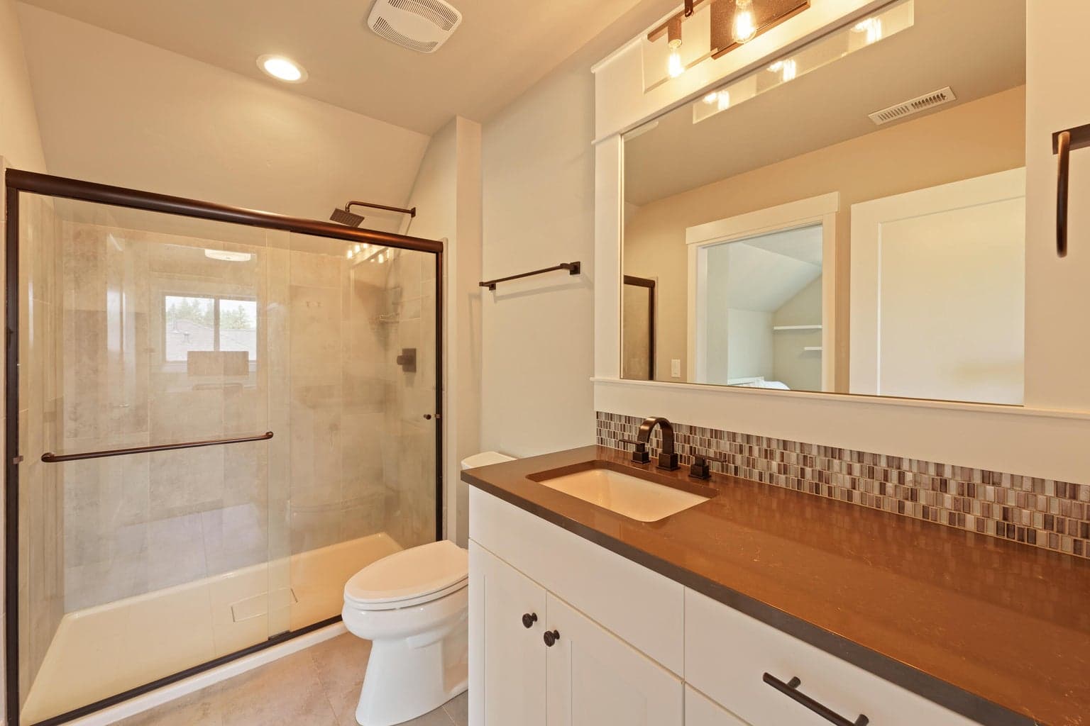 Upstairs guest suite bathroom with separate hall entrance