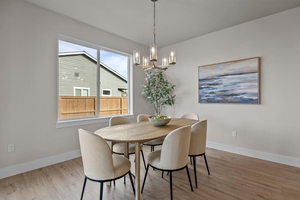 Dining area - Upgrades and staging noted. Specs & finishes vary. Sample photo reflecting a similar plan.