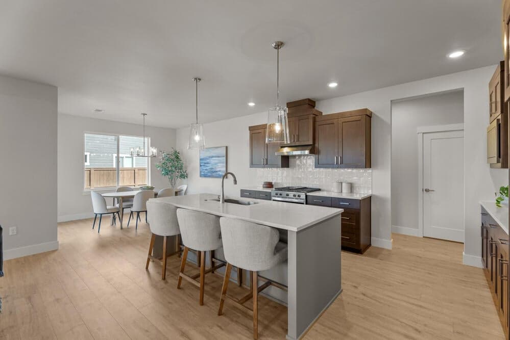 Kitchen - Upgrades noted. Specs & finishes vary. Sample photo reflecting a similar plan.