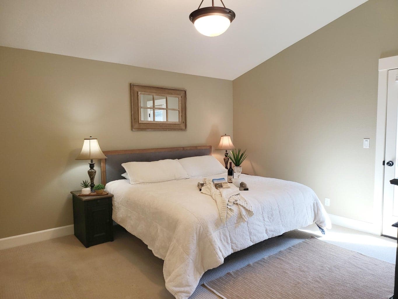 Primary bedroom is en-suite with walk-in shower and door to the hot tub