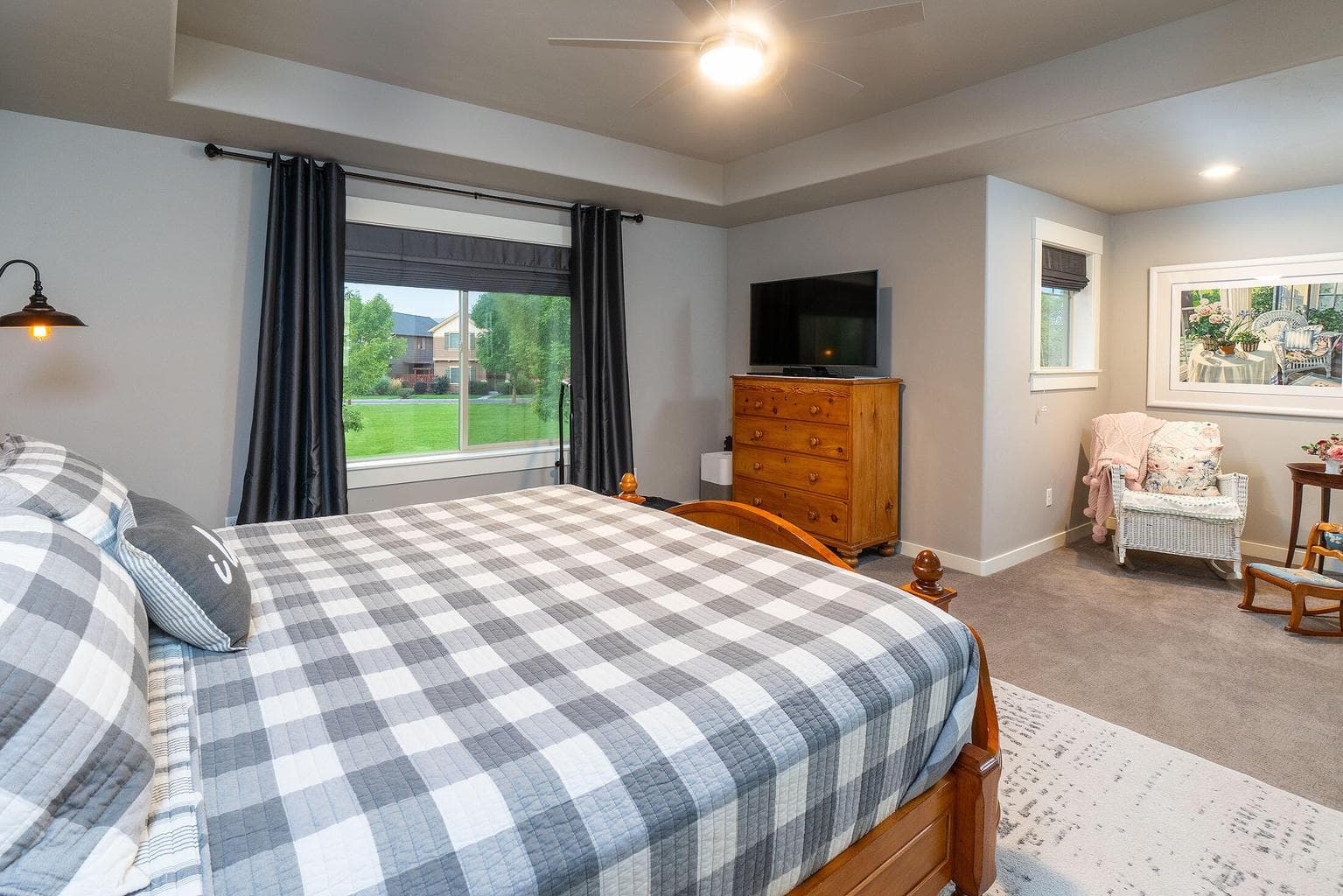 Primary suite with sitting area overlook the park
