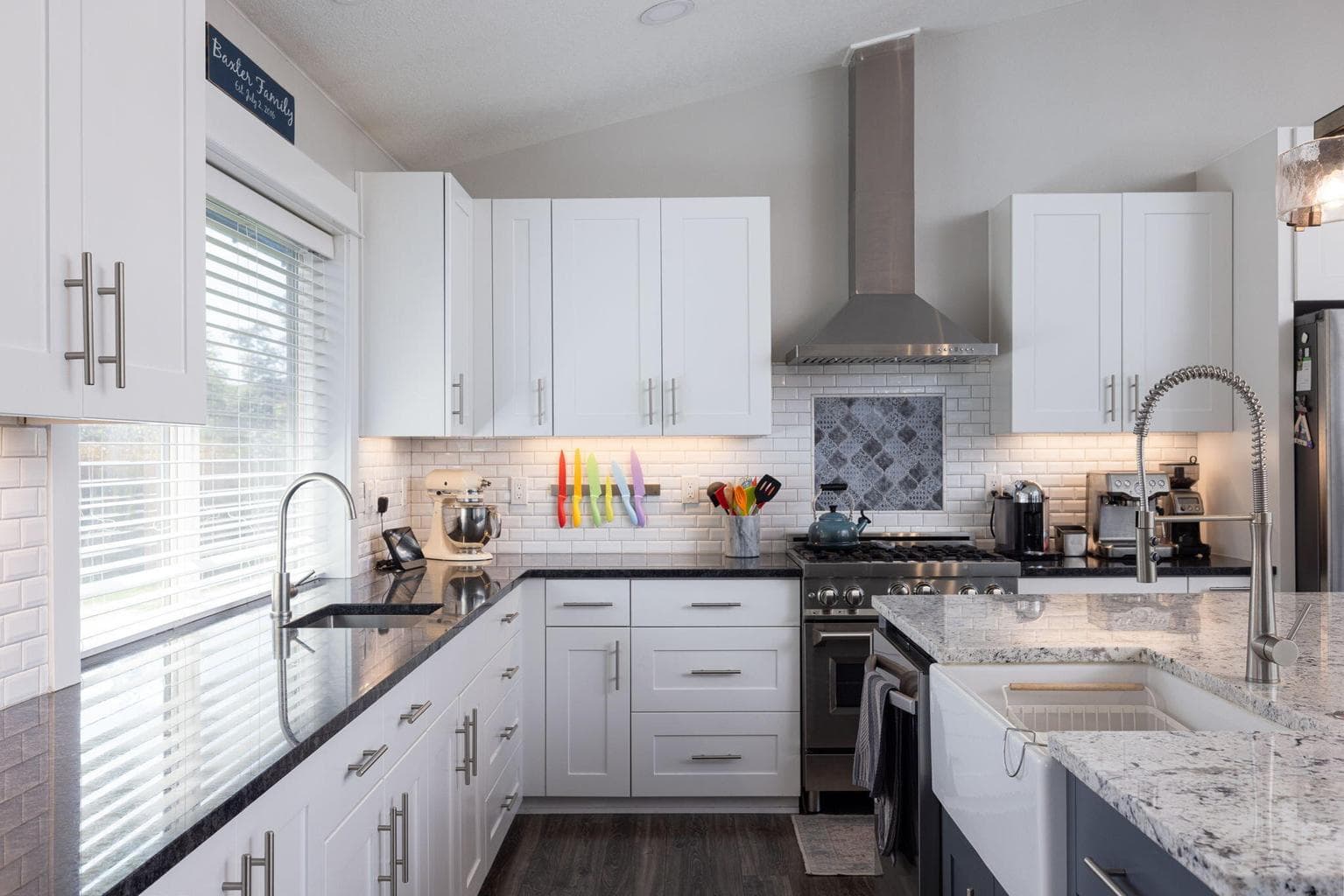 Beautifully updated kitchen with a farmhouse sink and an additional prep sink