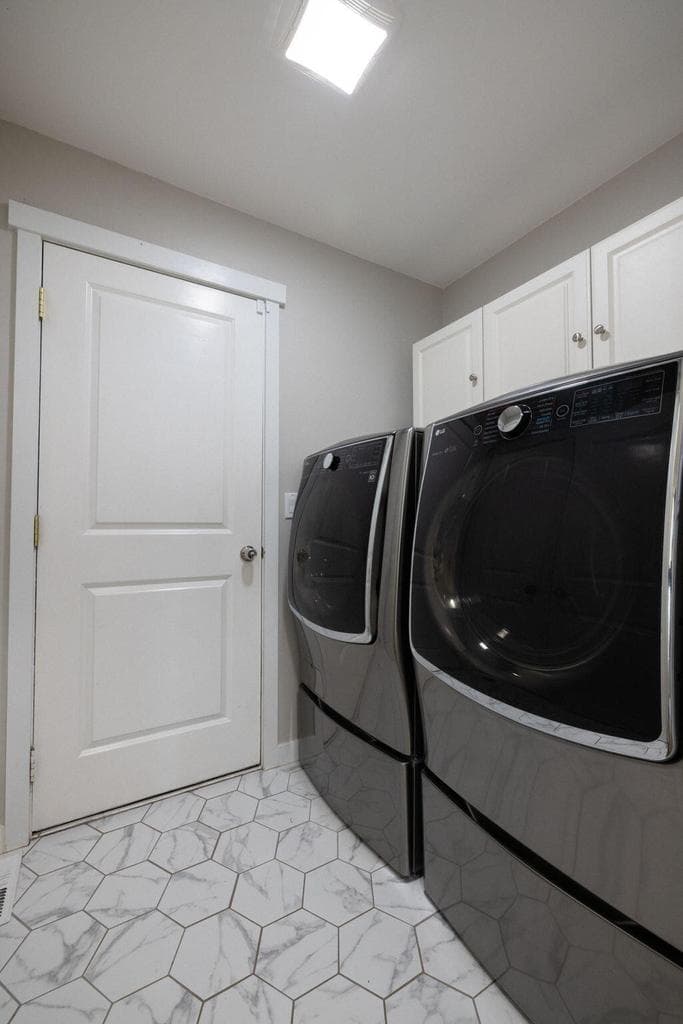 Laundry room with updated flooring and paint