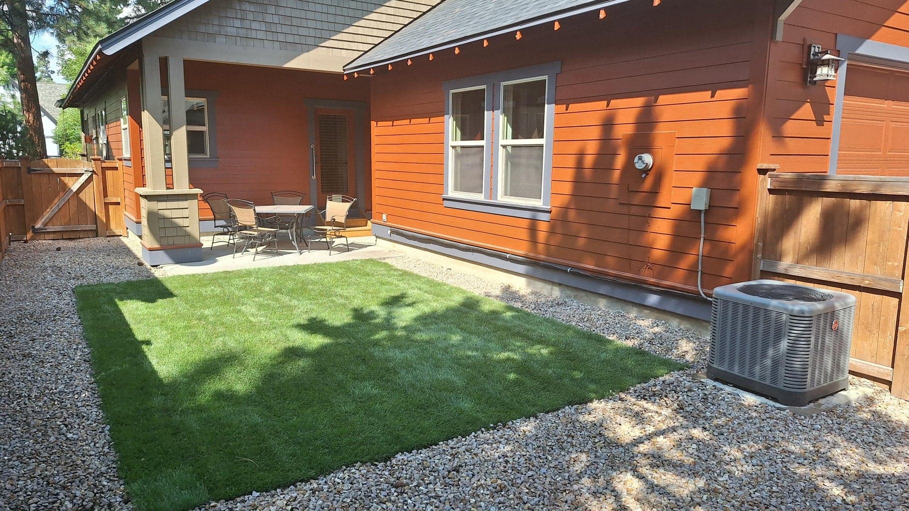 Fully fenced back yard with covered patio space.
