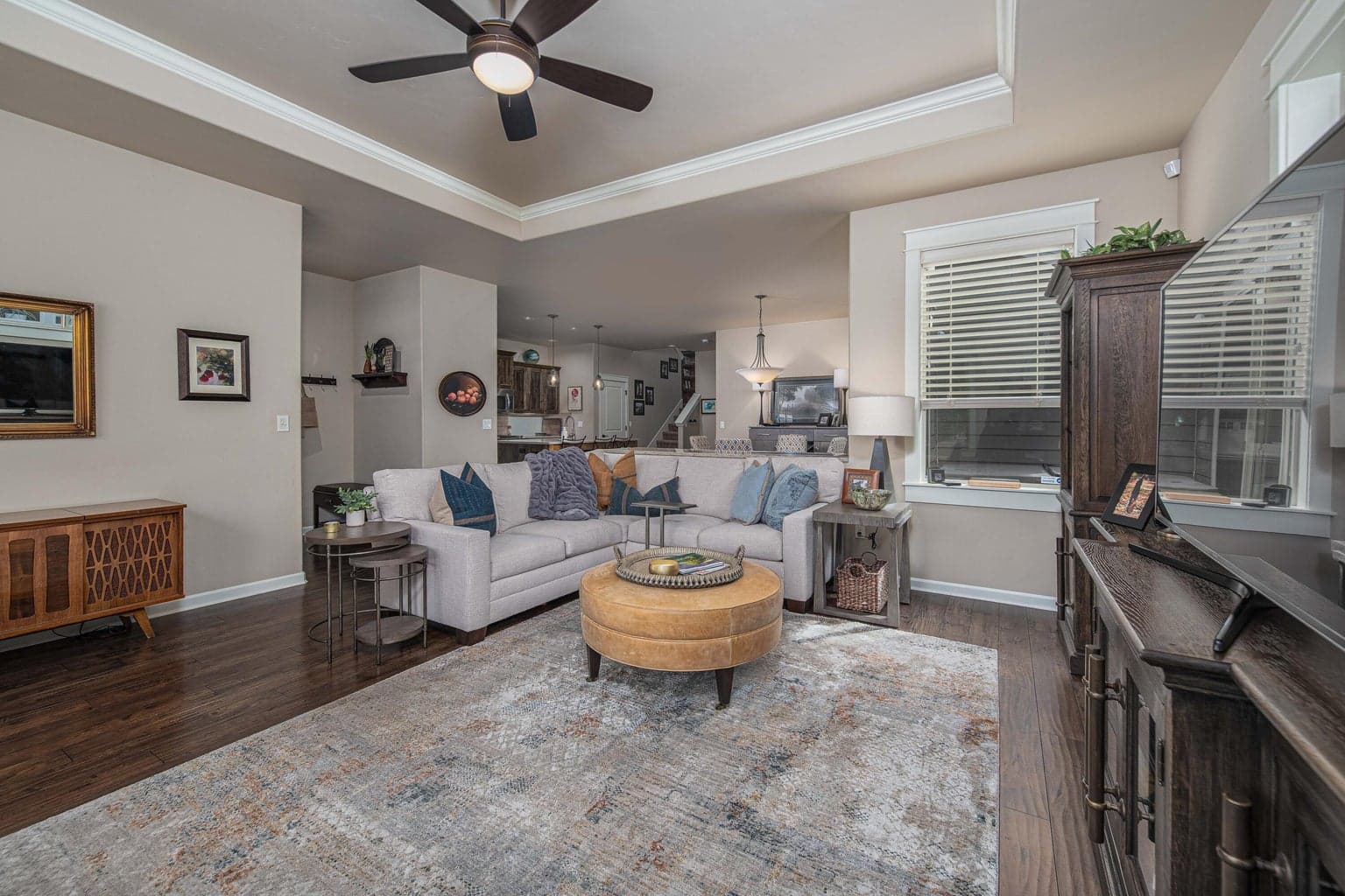 Tre ceilings and crown moldings and wood wrapped windows throughout the downstairs
