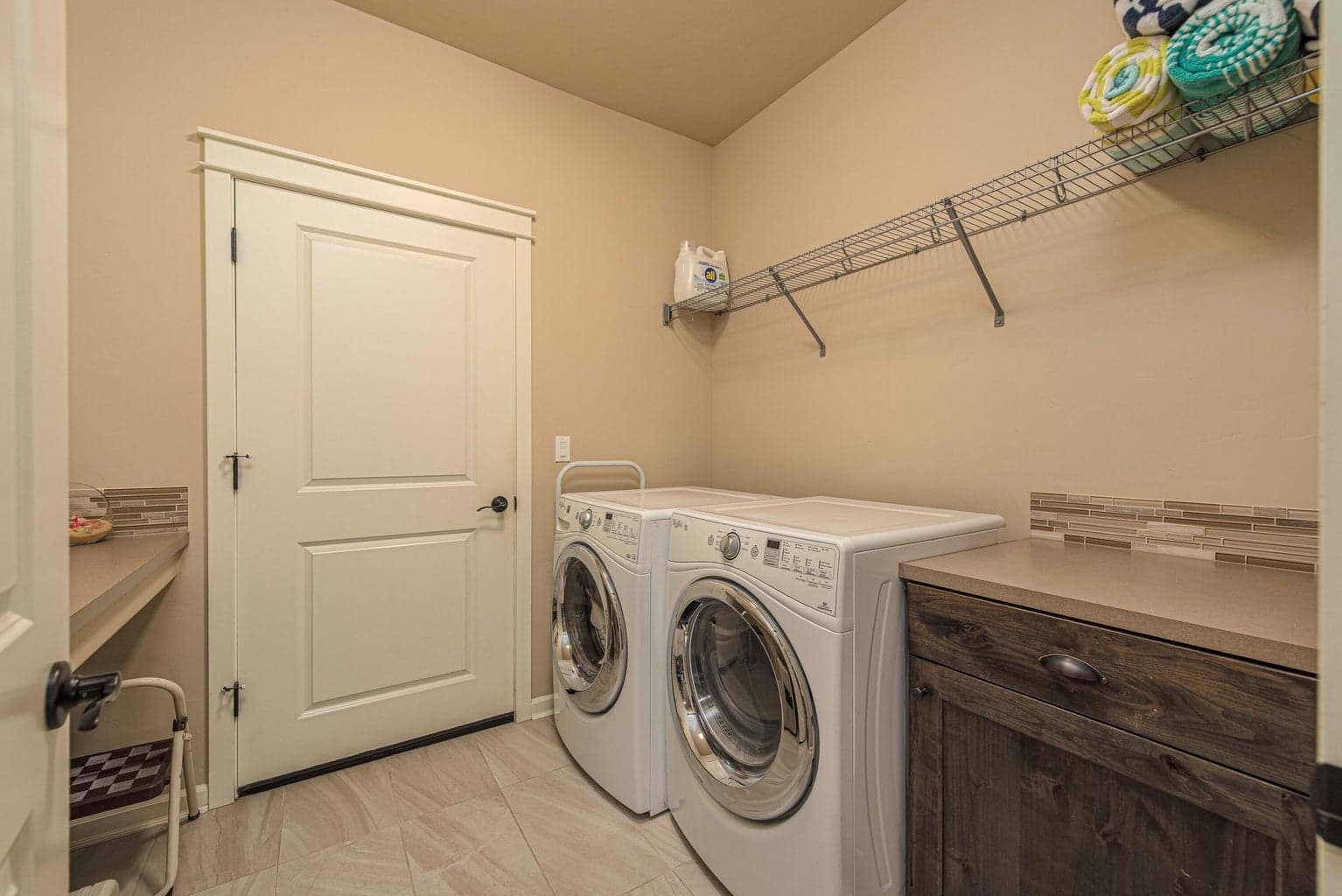 Downstairs laundry off of the oversized 2 car attached garage