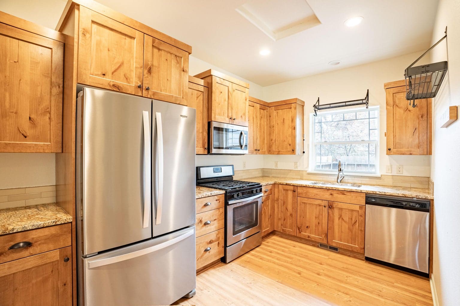 Kitchen Offers Stainless Appliances, Wood Cabinets, Granite tops
