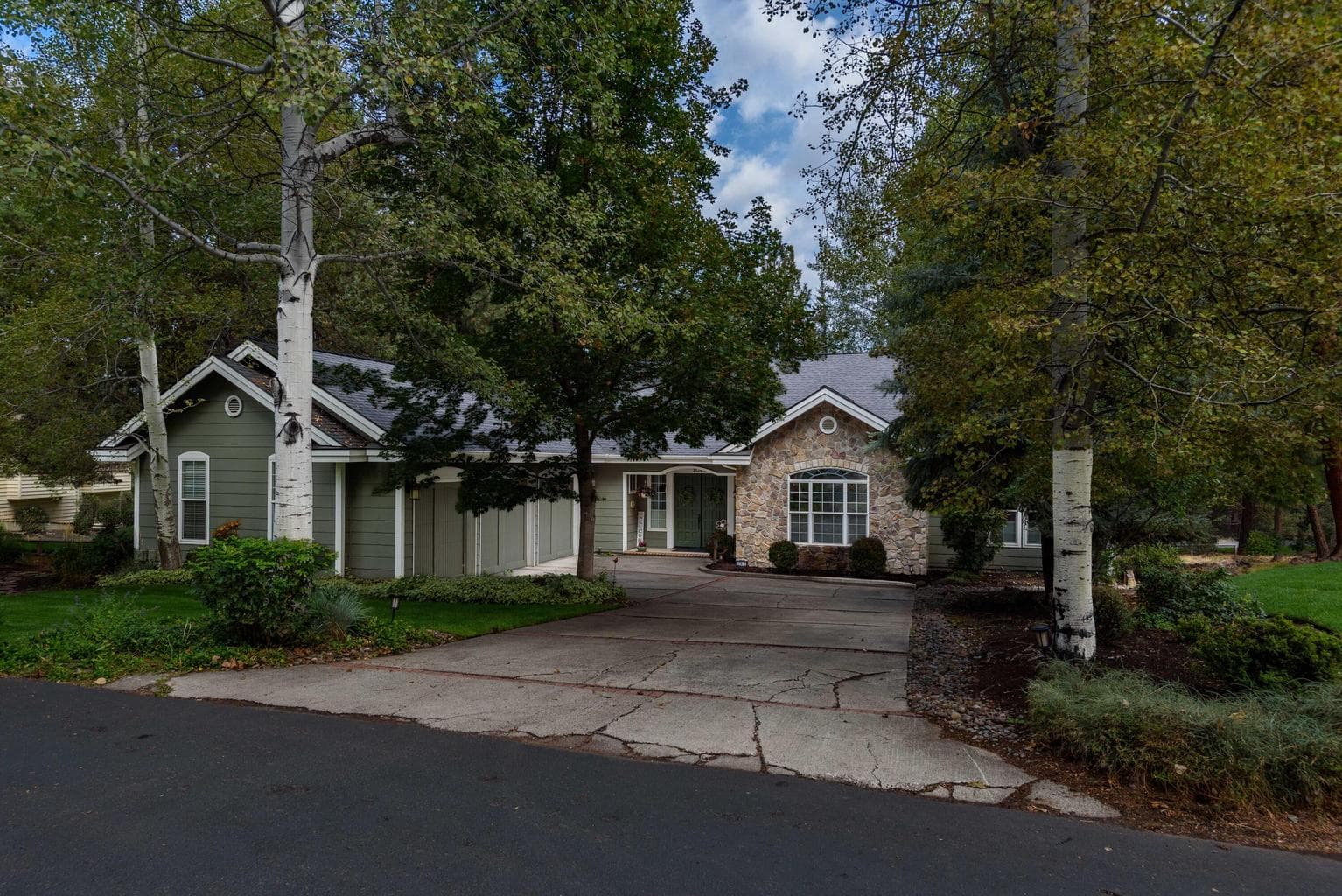 Large .31 lot with lush mature landscaping and trees.