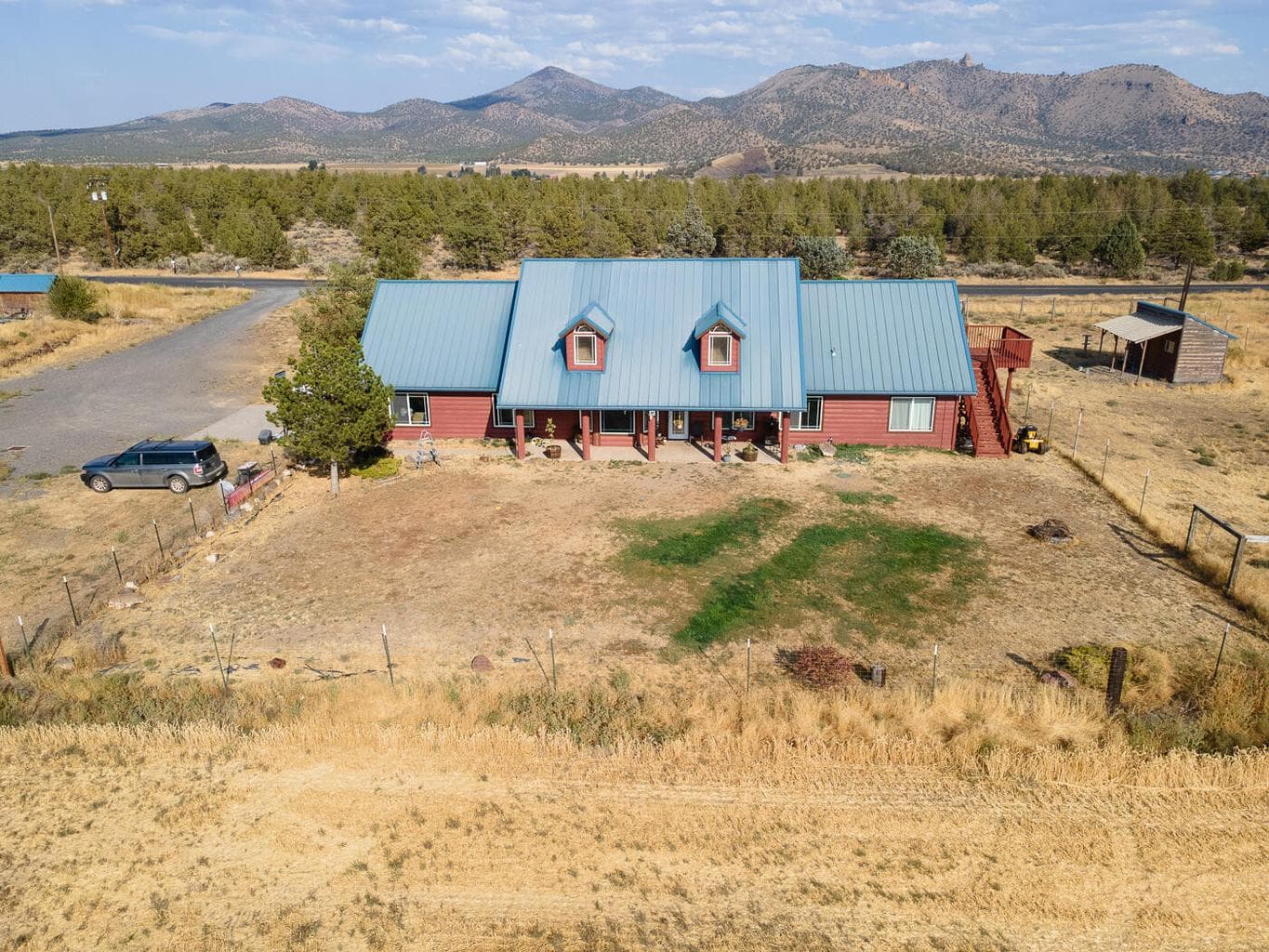 Log home showing back yard space fenced