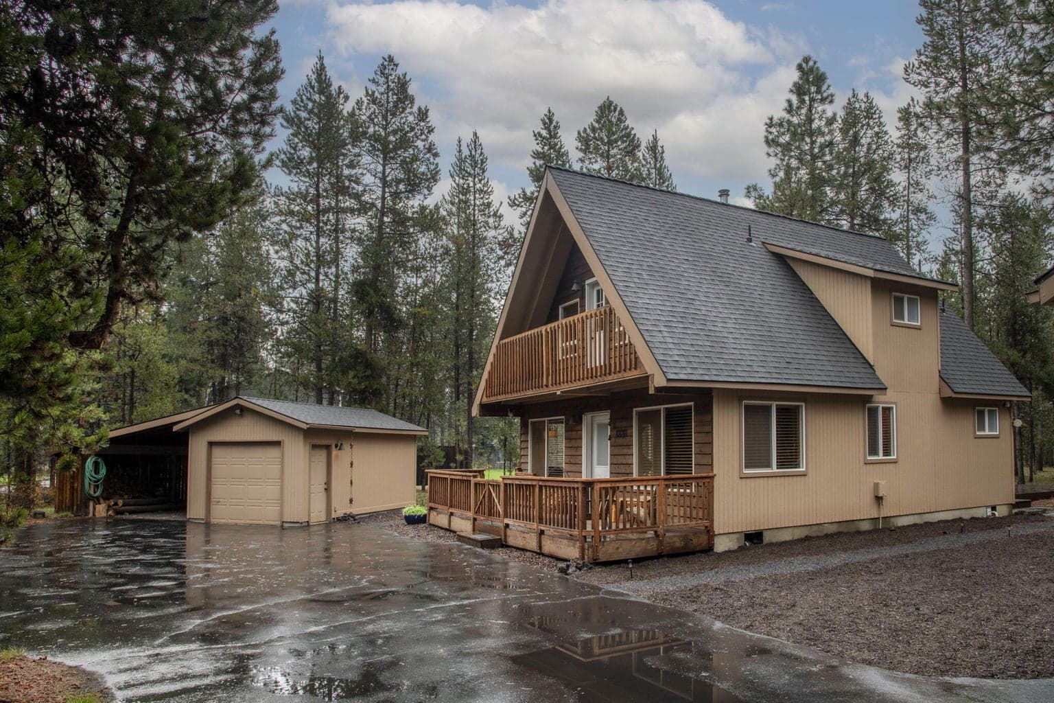 Darling 3 bedroom, 2 bath in the woods...with additional bunkhouse off the two-car garage!