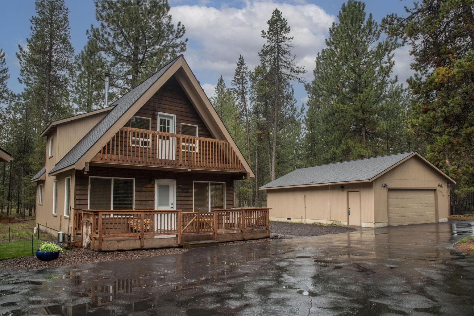 The 2-car garage in the back ground has a large bunkhouse and deck attached