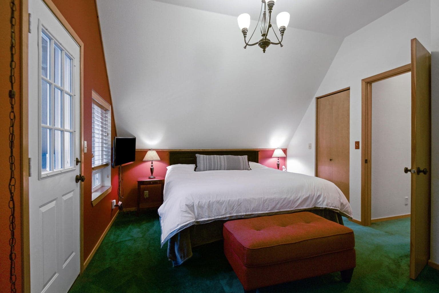 This bedroom is the largest (and accommodates a king-size bed) It's located on the second level and has a covered deck attached