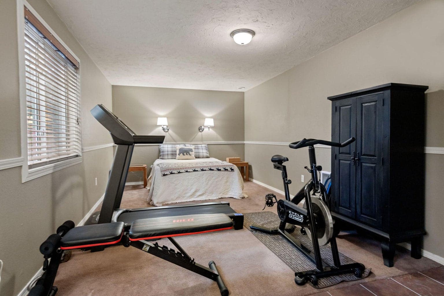 Interior of the bunkhouse. It's the width of the oversized 2-car garage and accommodates a sleeping area and a workout area