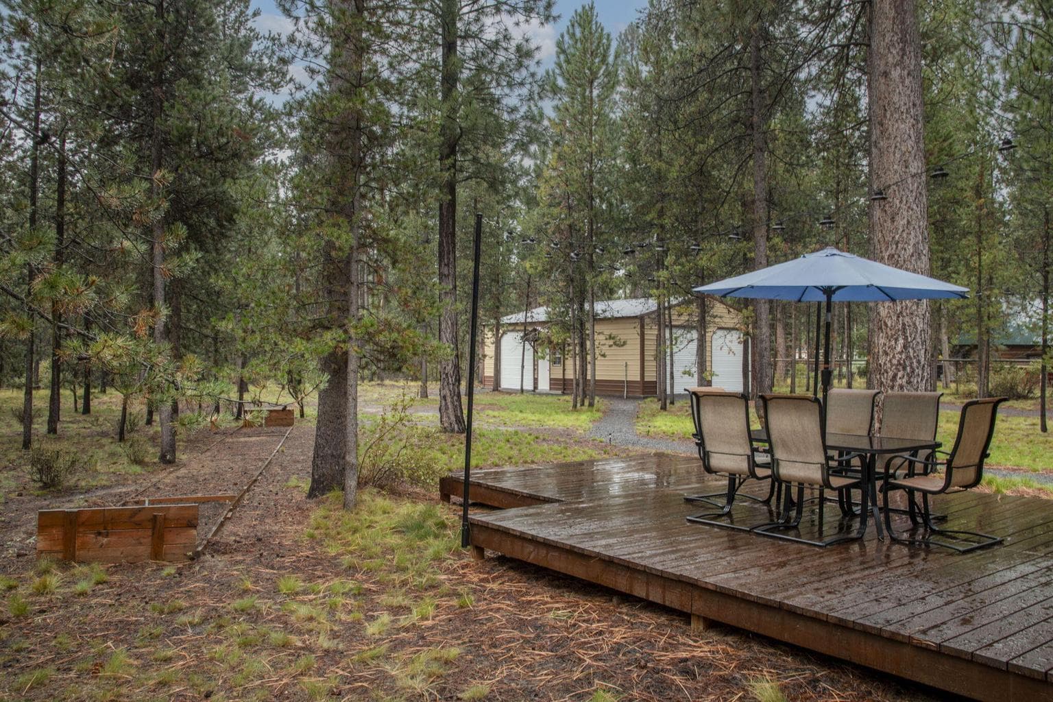 On over an acre with large deck, horse shoe pit, and lots of trees for privacy