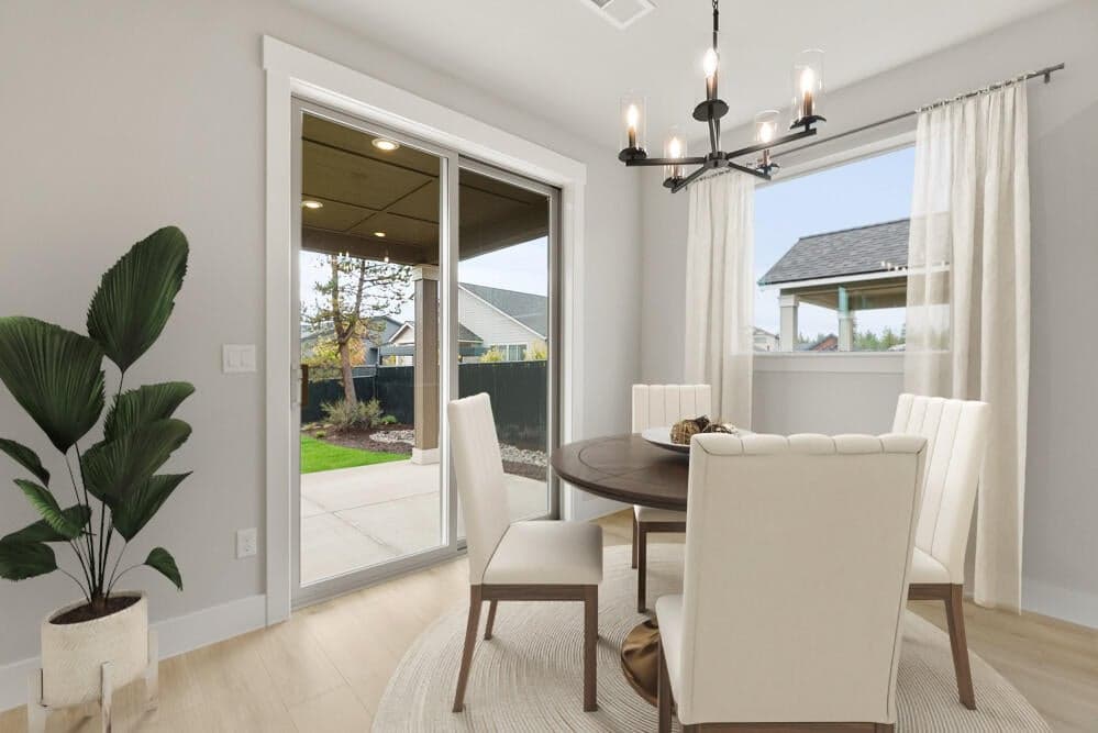 Dining area just off the expansive covered patio. This photo has been virtually staged.