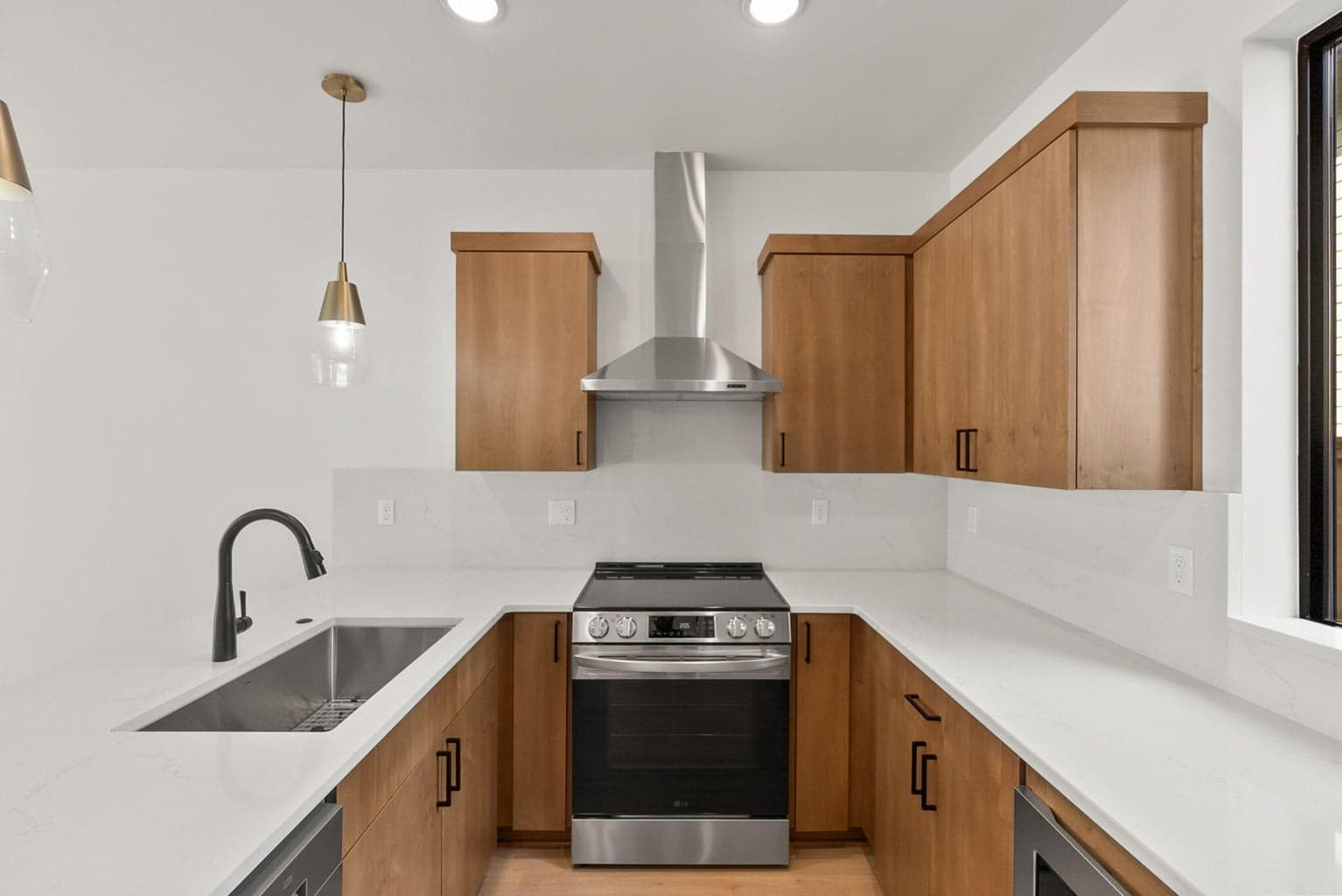 Quartz countertops and full height backsplash