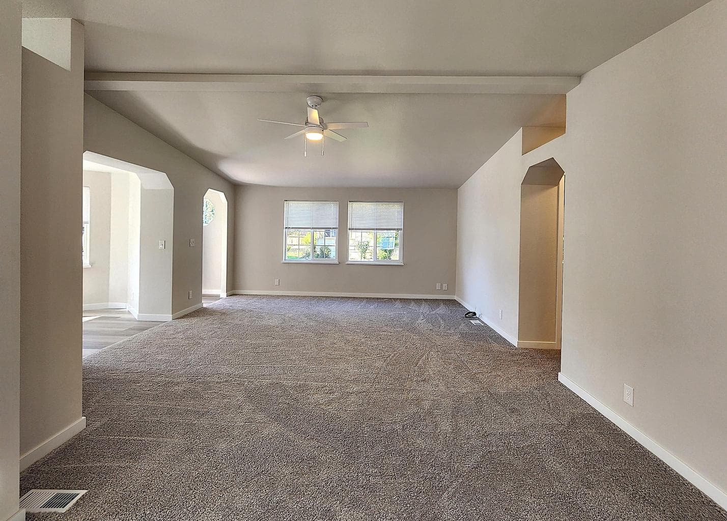 Great room has ceiling fan