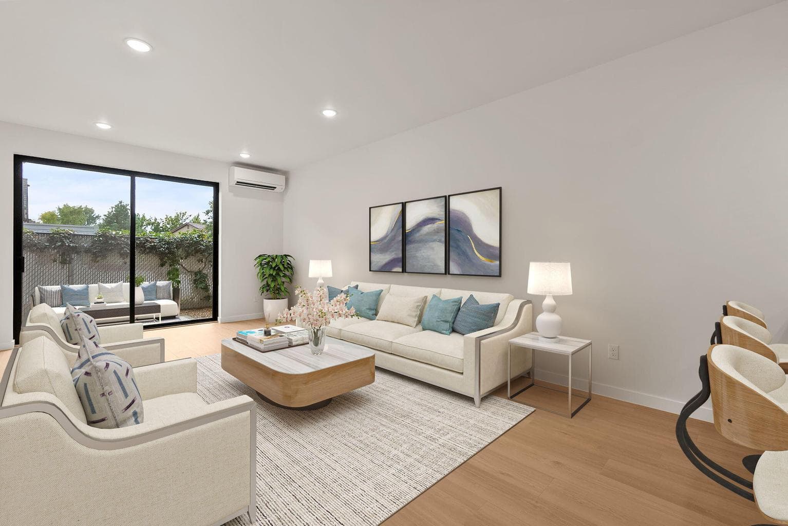 Living room with private outdoor patio. Oversized sliding door.