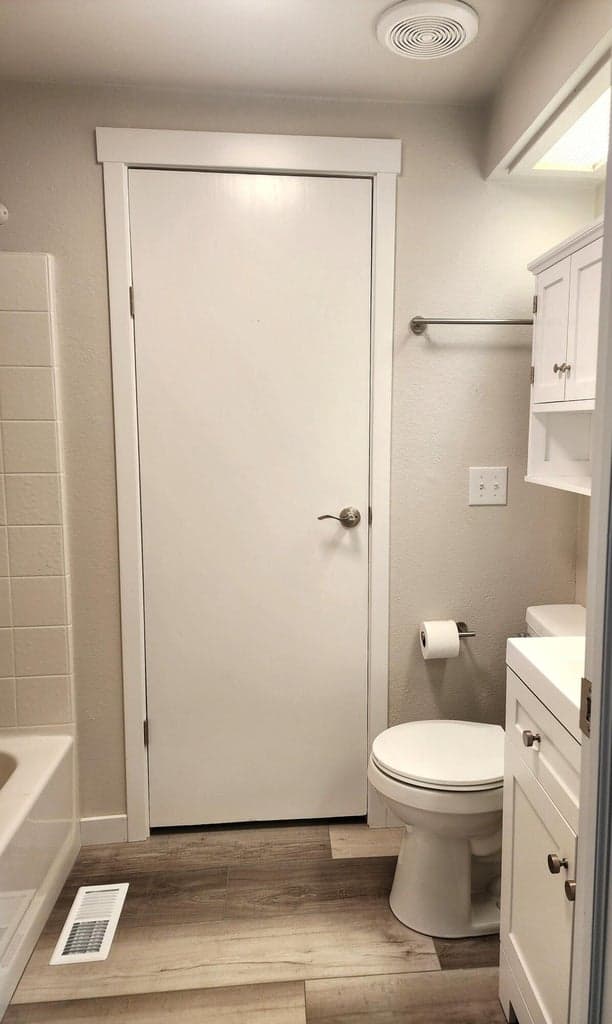 Guest bathroom with new toilet, vanity, lights, and more!
