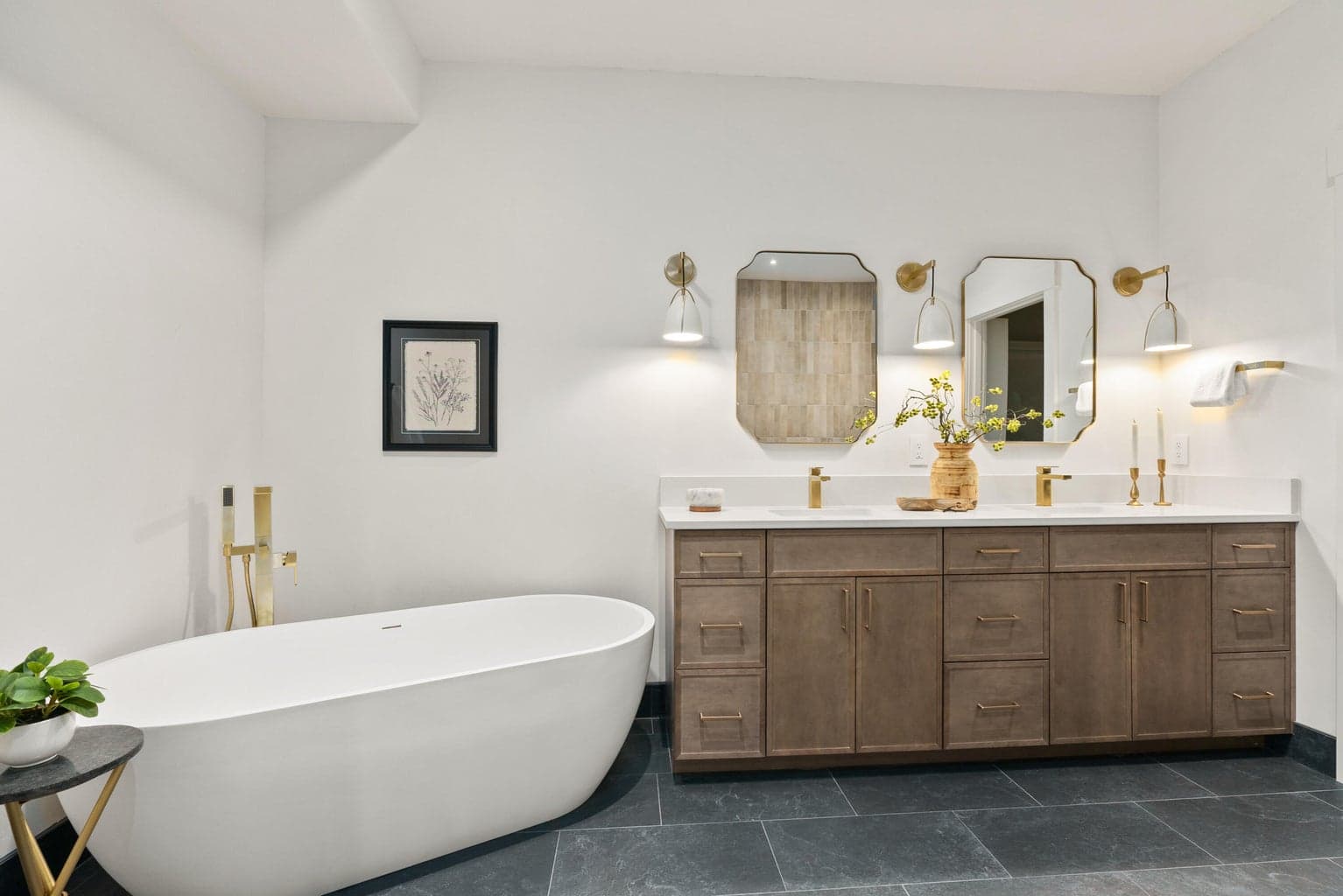 New cabinet, flooring, light fixures, soaking tub in primary bathroom