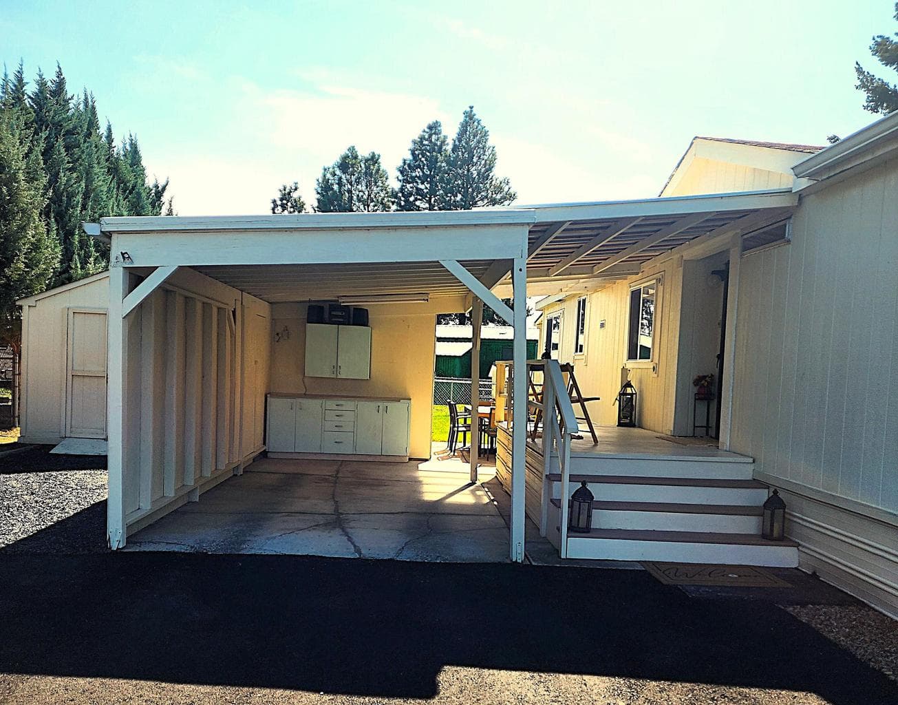 Attached carport with storage at the end