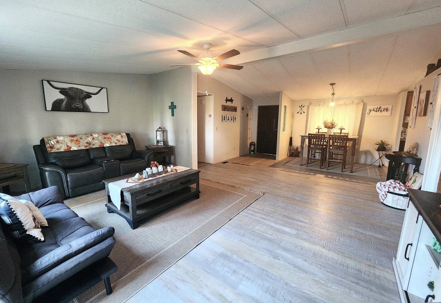 Great Room has ceiling fan and laminate flooring