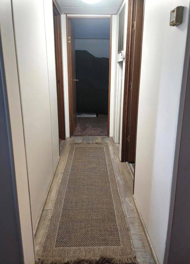Hallway to secondary bedrooms and guest bathroom